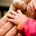 Parent and baby holding hands - flickr creative commons image by aaron gilson (flic.kr/p/9fWraA)